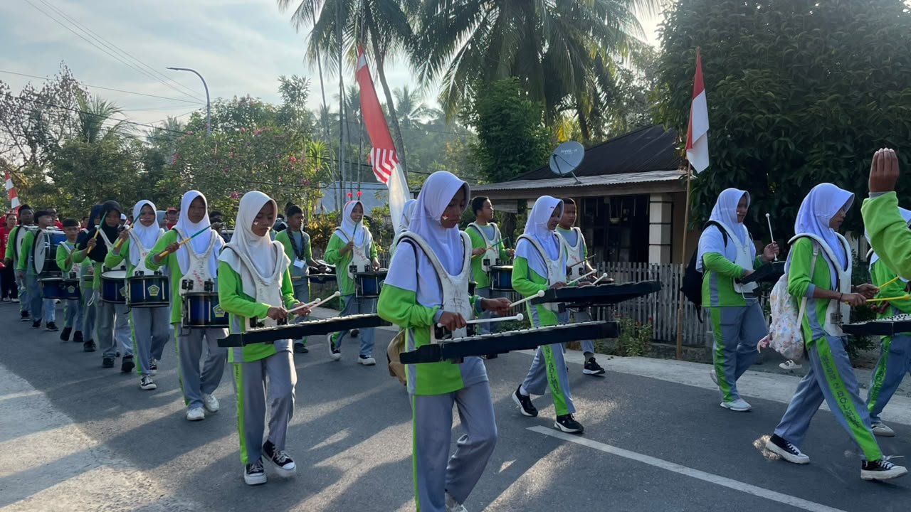 Marching Band Gita Mania MTsN 2 Boltara Pecahkan Suasana Pagi, Meriahkan Jalan Sehat Kerukunan
